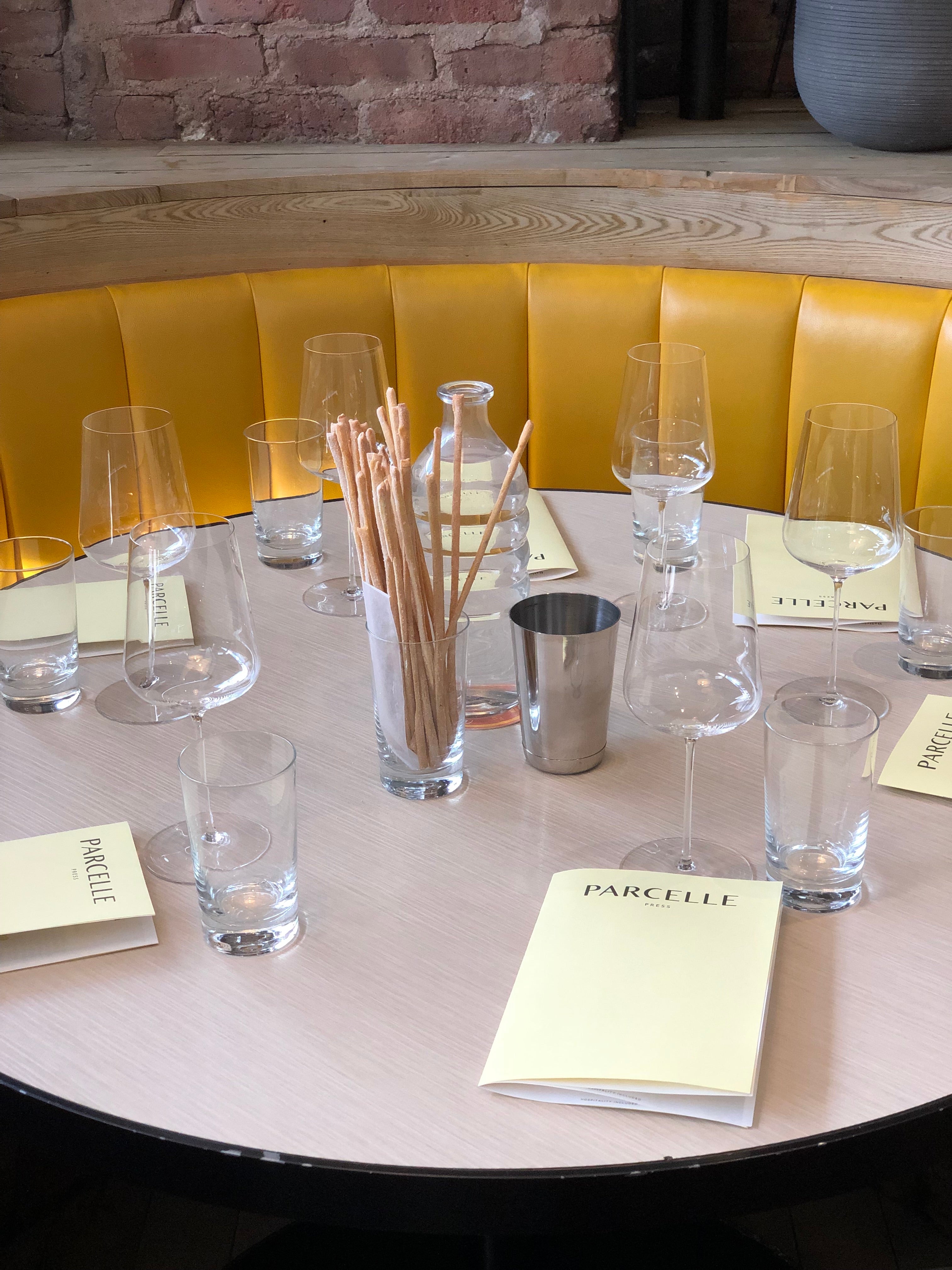 Wine School background image with Parcelle menus at a table